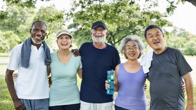 A group of older people smiling after exercising